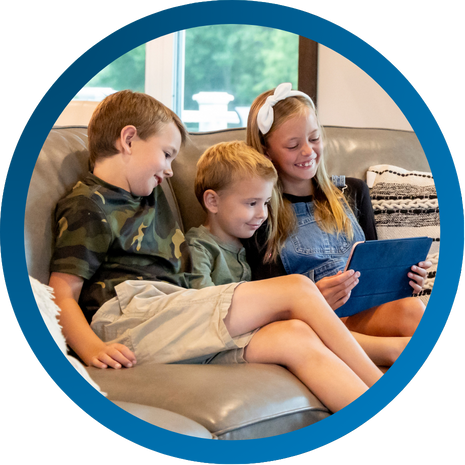 Young kids playing on an iPad using Vibrant internet.