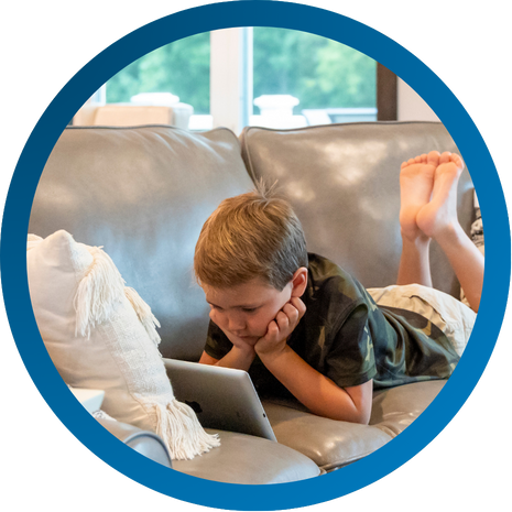 Young boy looking at a tablet device  using Vibrant internet.