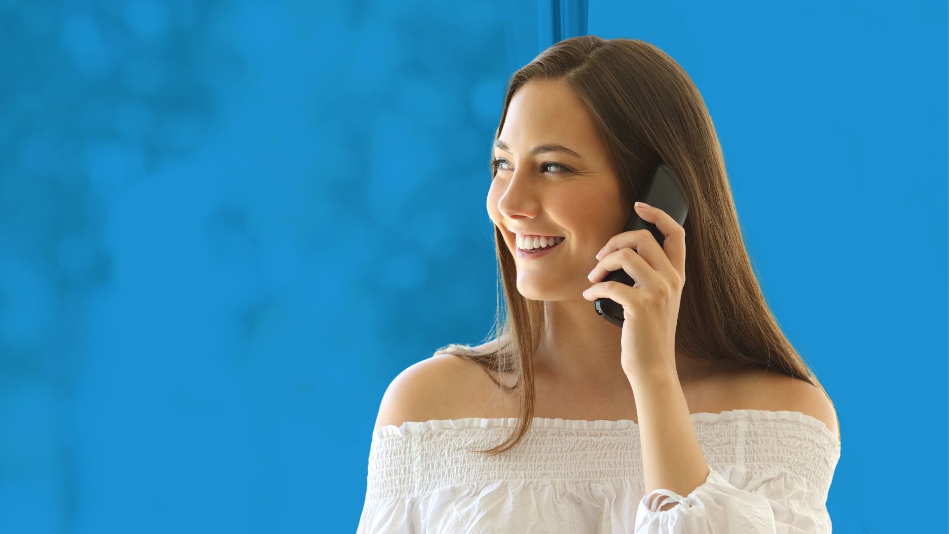 Woman talking on a residential phone